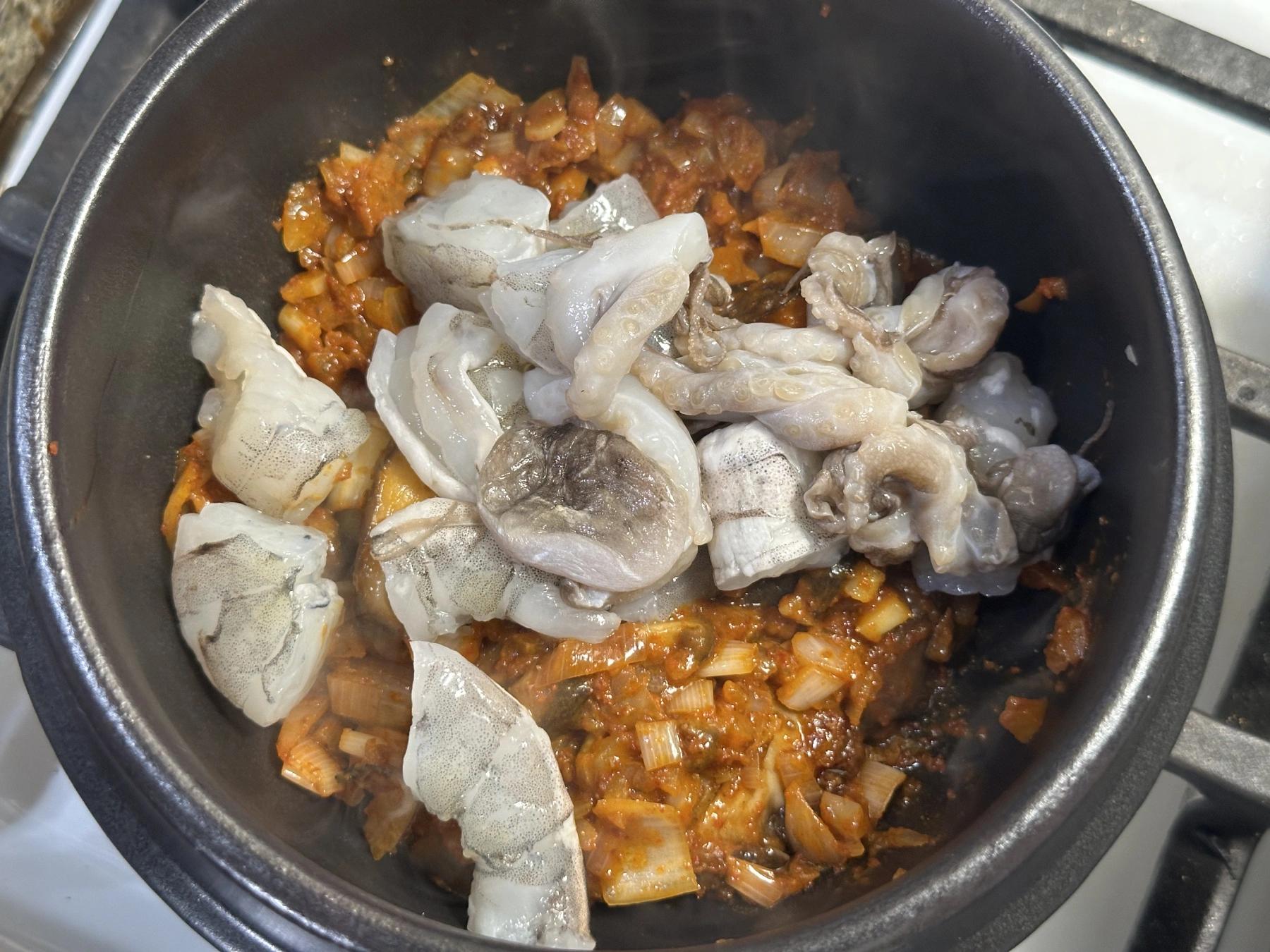 seafood added to the pot