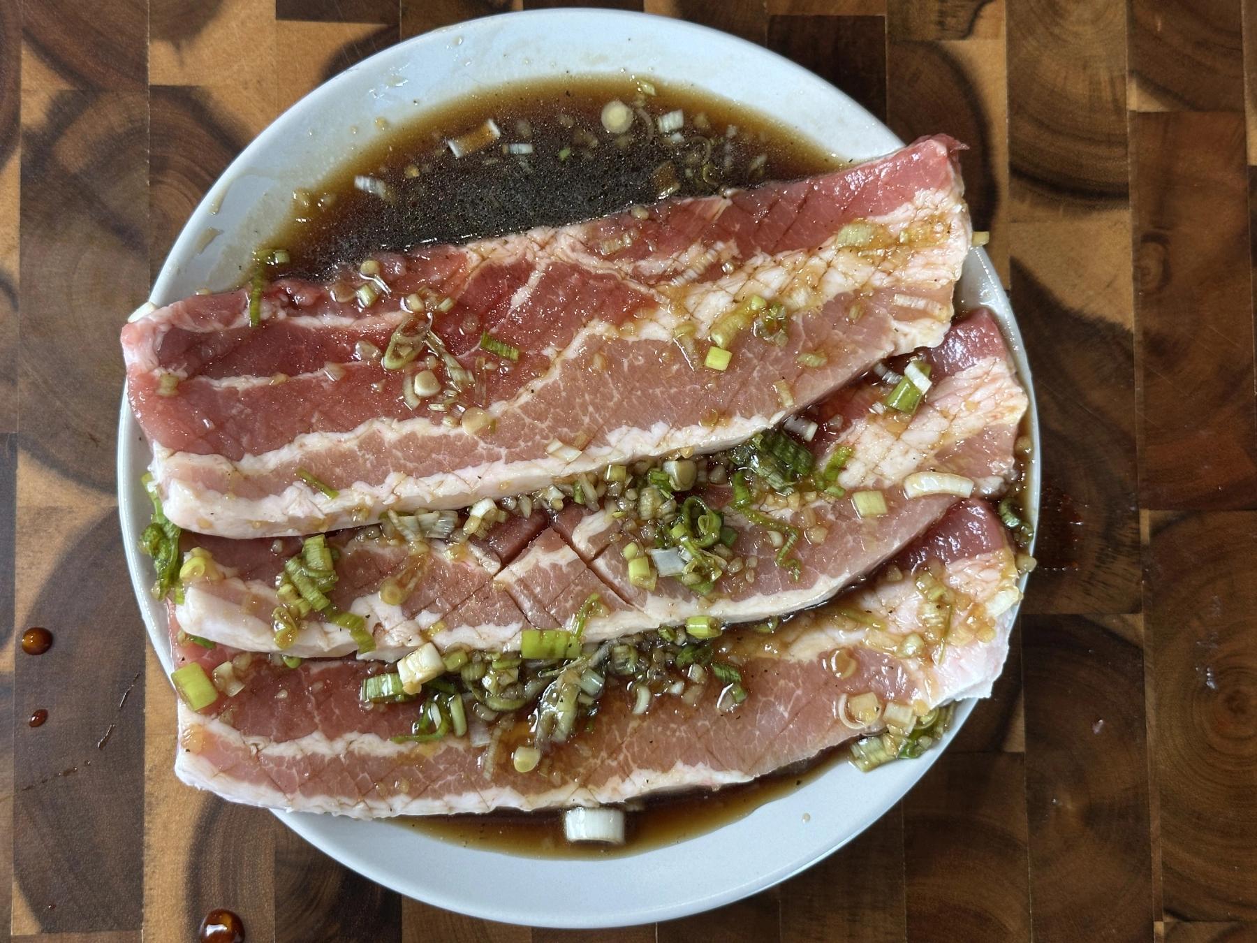 pork belly meat covered with marinade sauce
