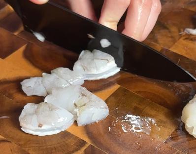 cutting shrimps into pieces