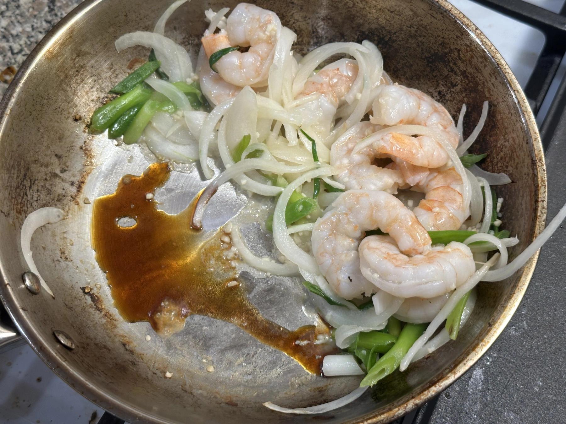 soy sauce with shrimp, green onion, onion and garilc