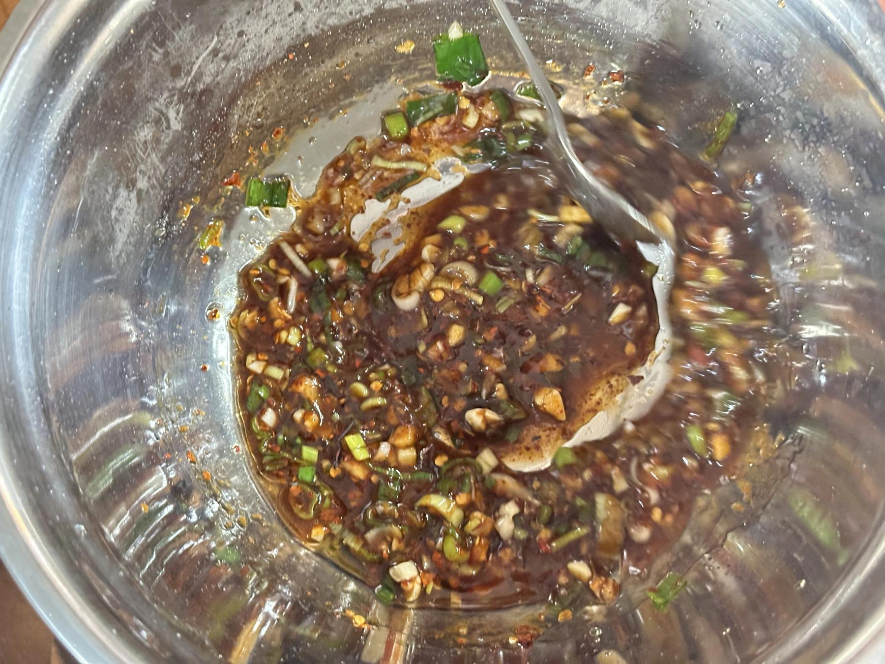 mixing sauce with hot oil
