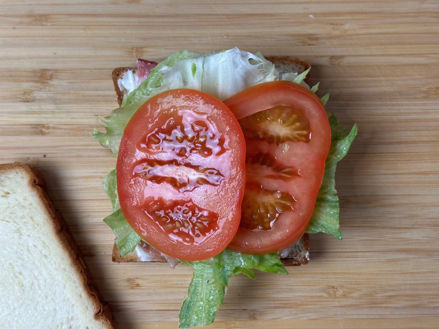 add tomato on the bread