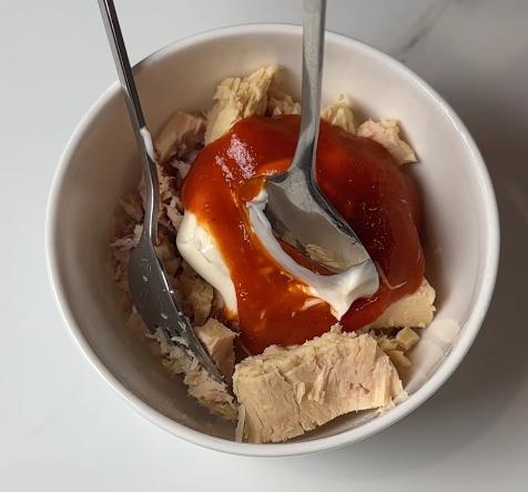 add mayo and sriracha sauce on the tuna