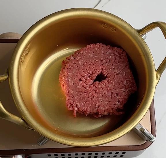 ground beef in the mixing pot