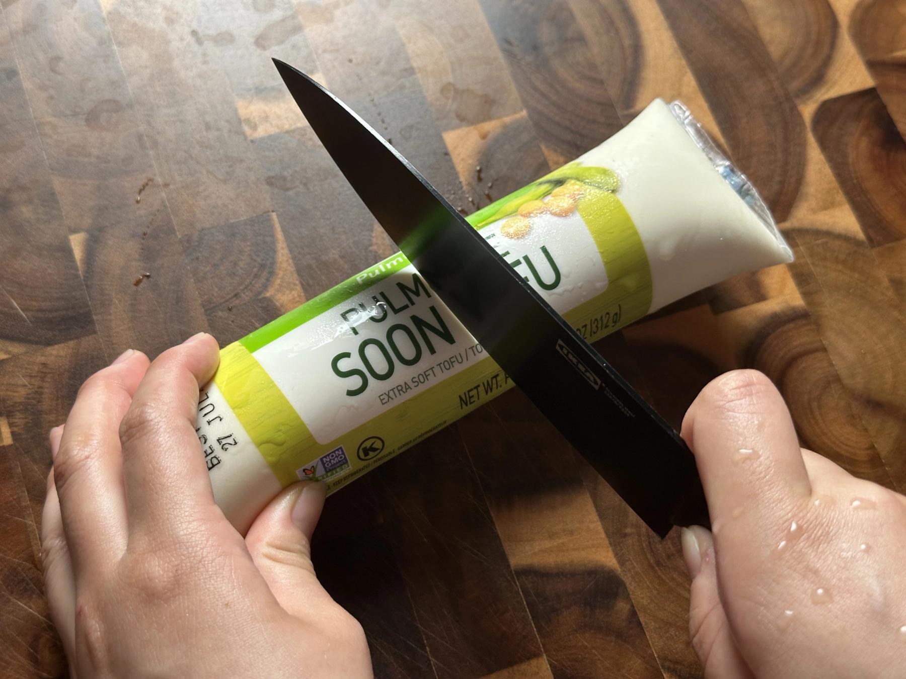 cutting soft tofu into half