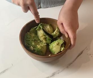 mashing avocado