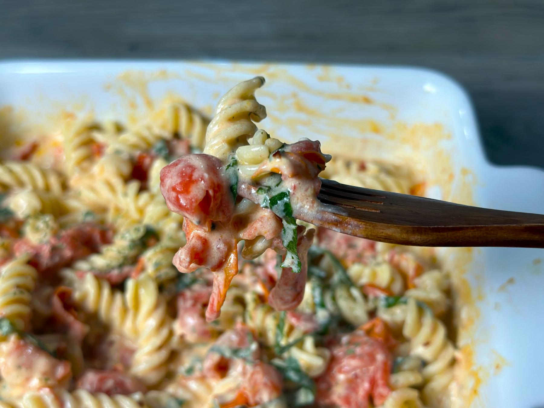 holding pasta with forks