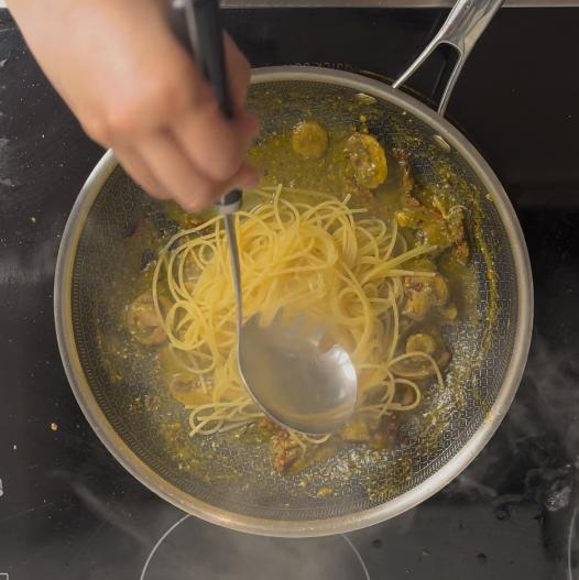 adding pasta and pasta water