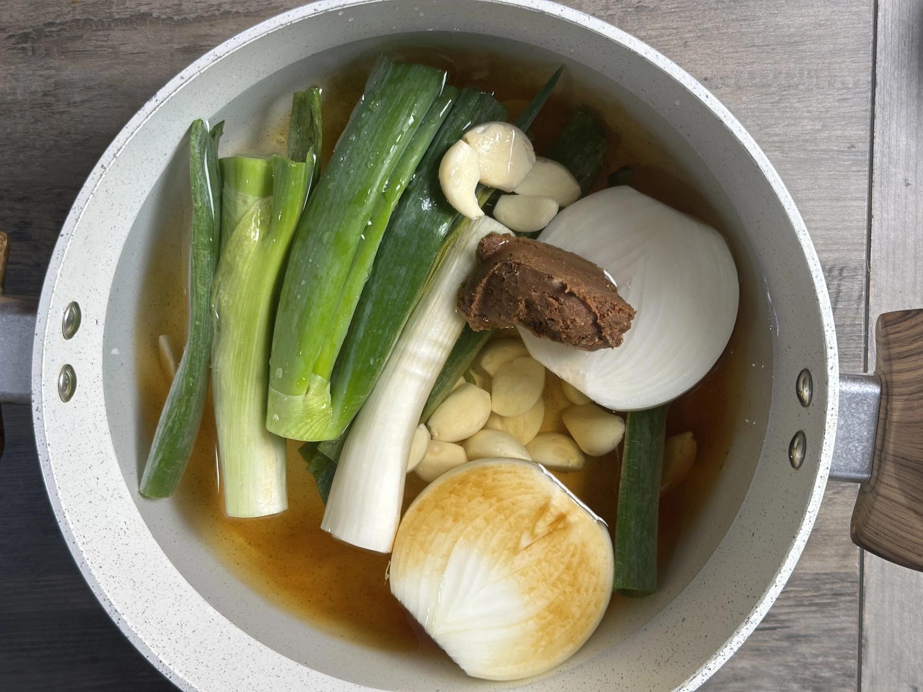 adding all ingredients except pork