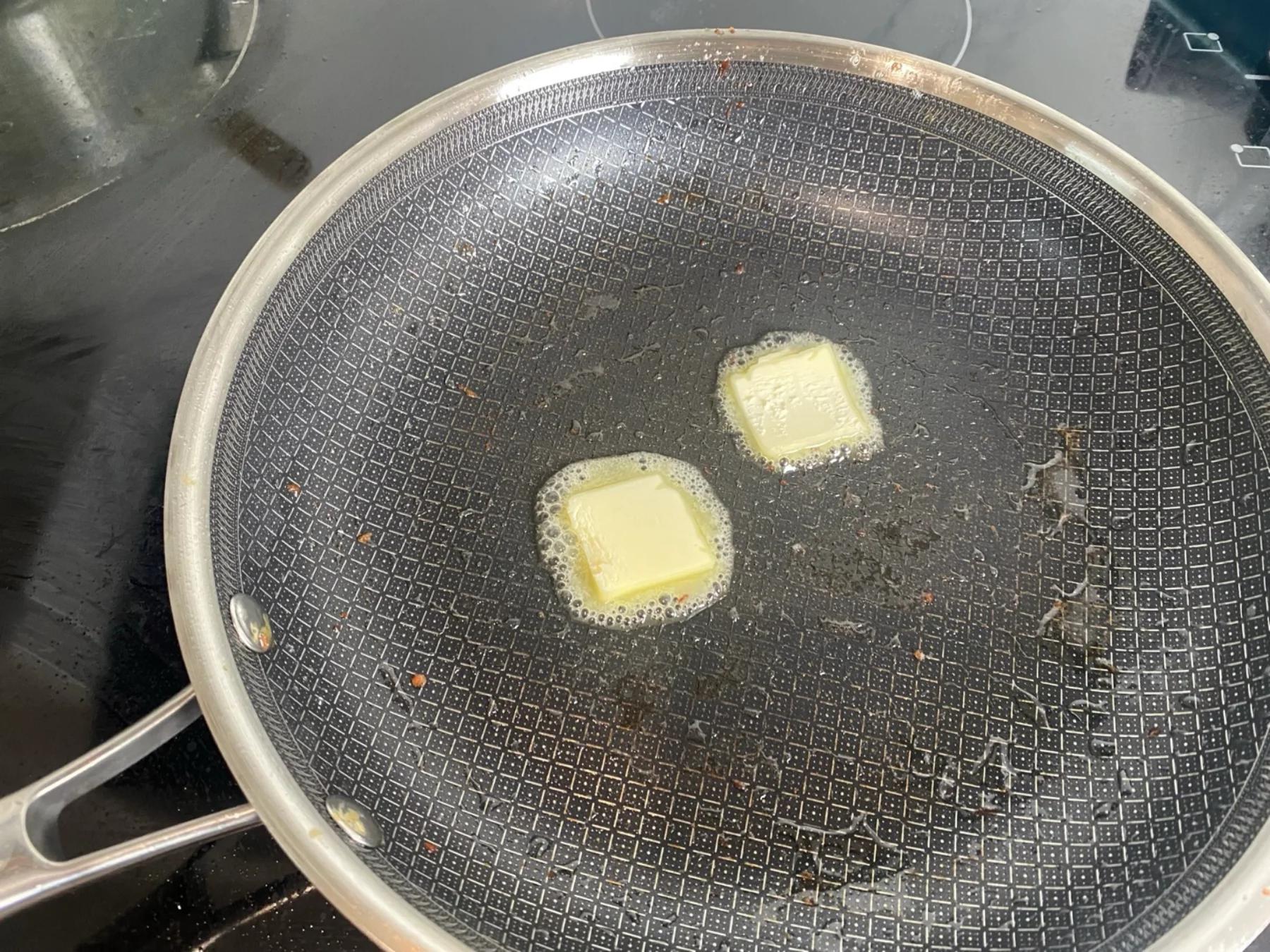 butter on the heated pan