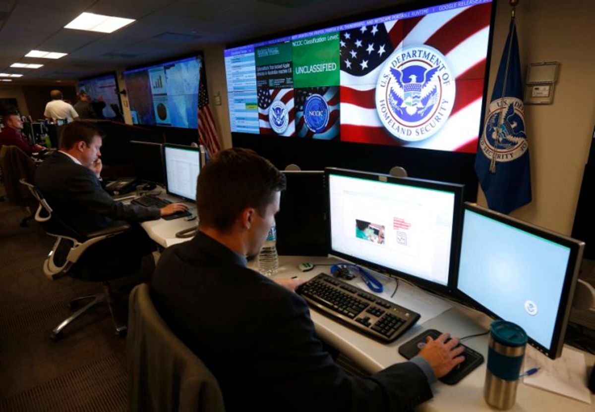 U.S. Department of Homeland Security employees work inside the National Cybersecurity and Communications Integration Center in Arlington