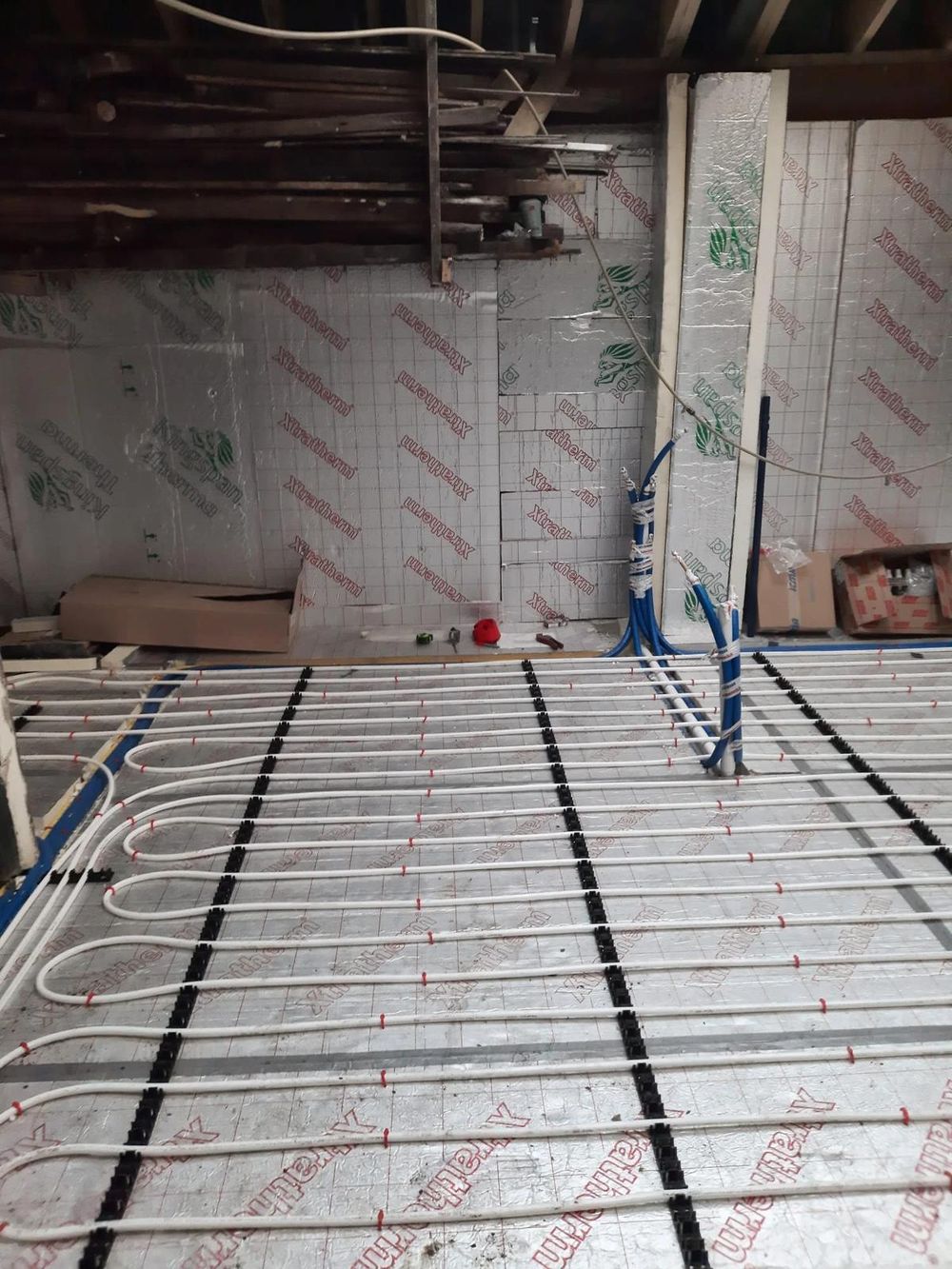 Underfloor heating pipes laid on Xtratherm insulation