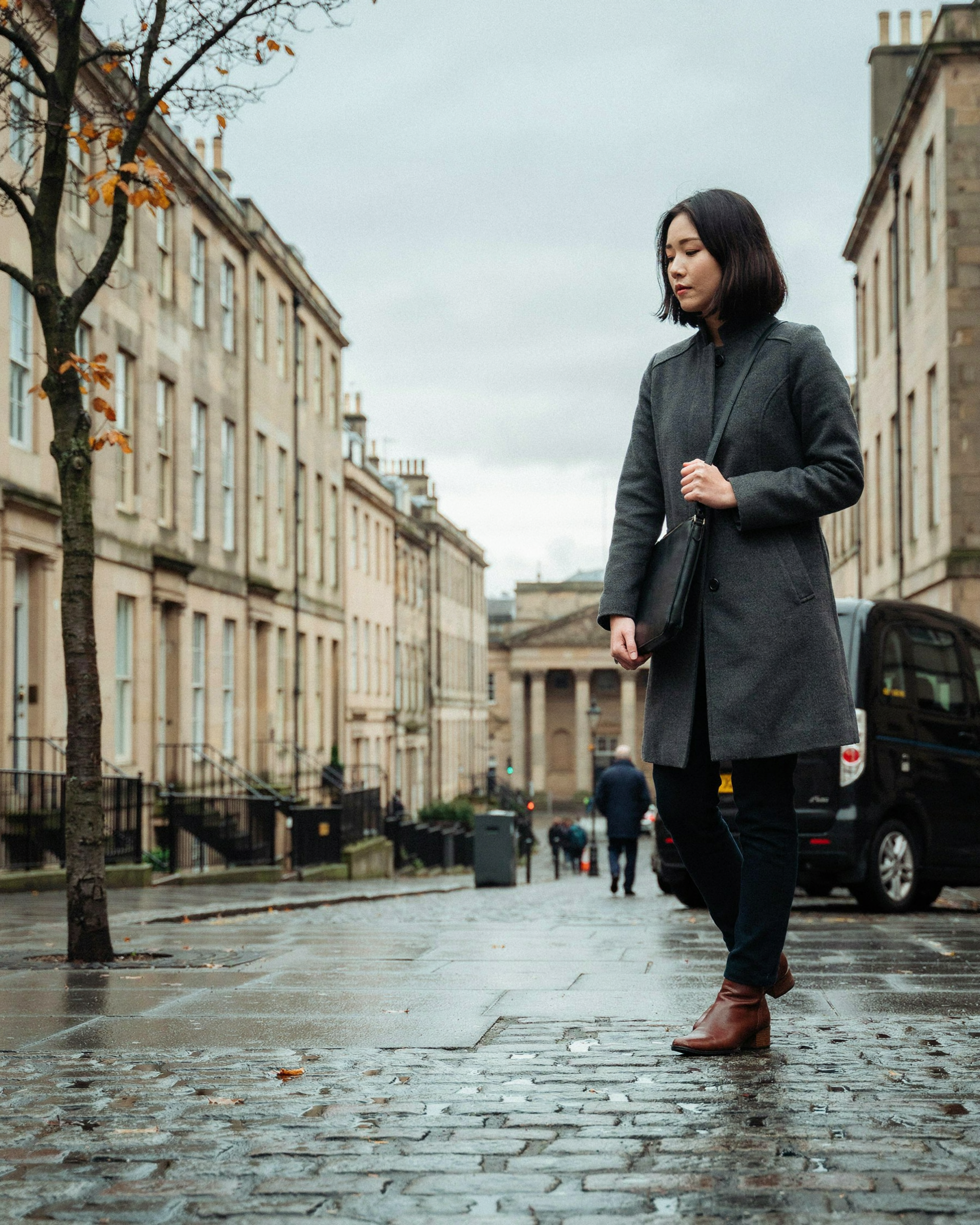 Postgraduate student walking along a Georgian street near George Square, Edinburgh