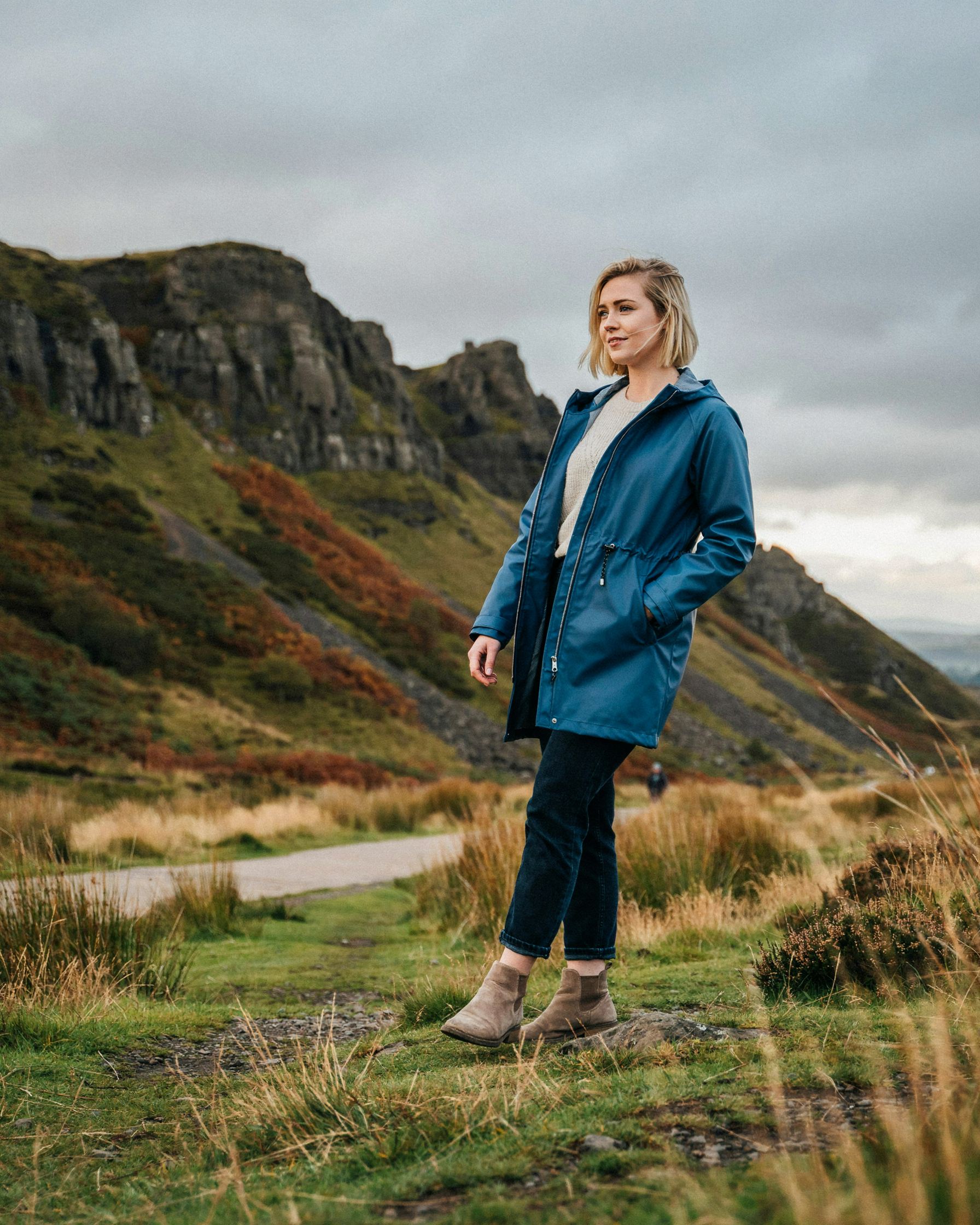 Student walking in Holyrood Park below Arthur's Seat, Edinburgh