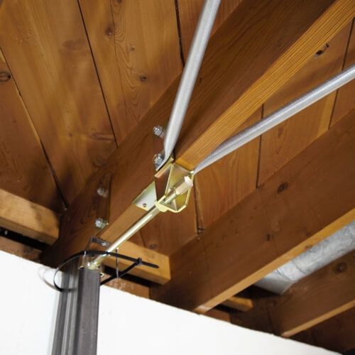 Perpendicular Gorilla Wall Brace system spanning three floor joists
