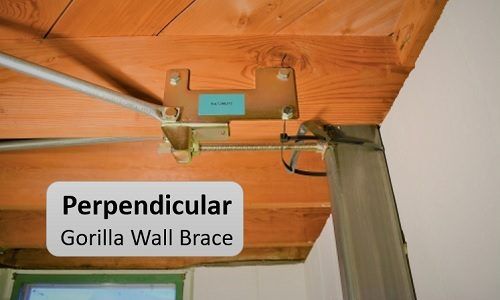 Perpendicular wall brace installed on basement wall