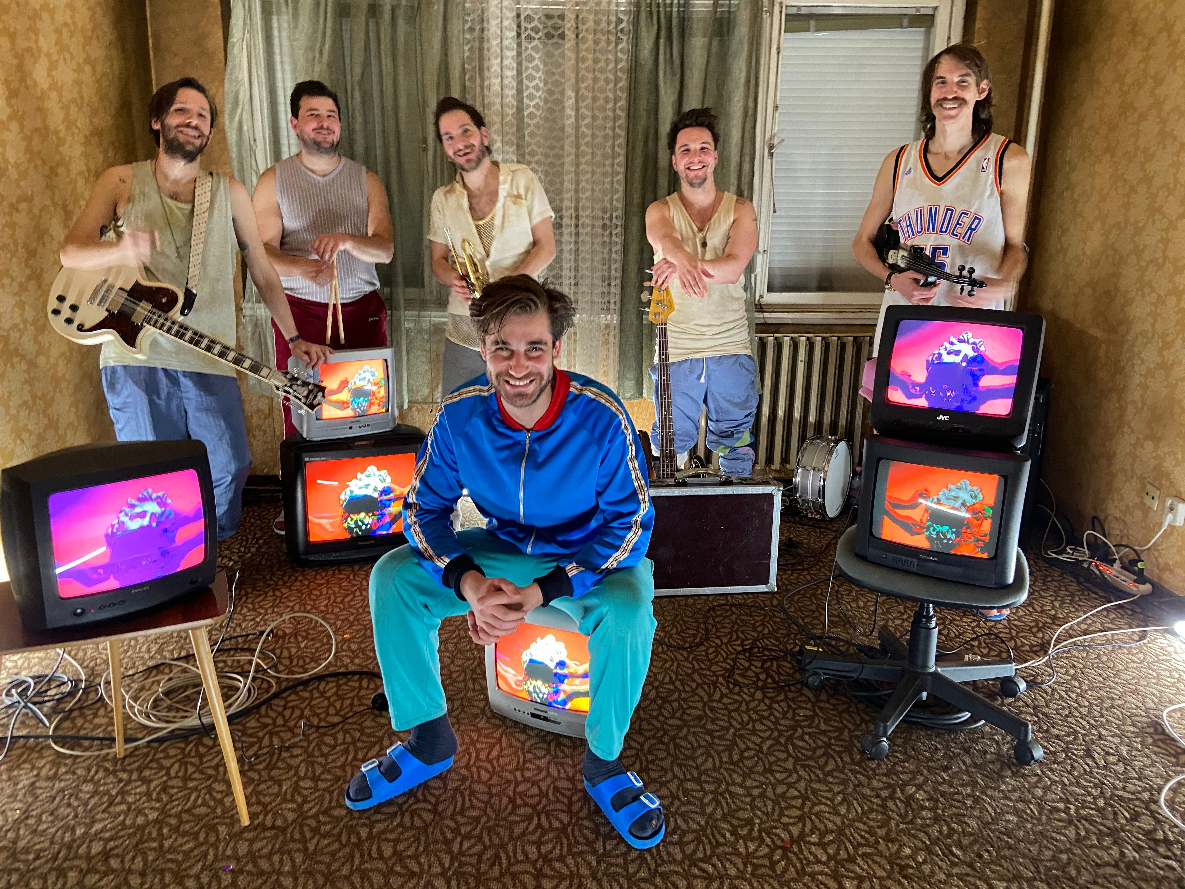 members of Bohemian Betyars sitting in a room