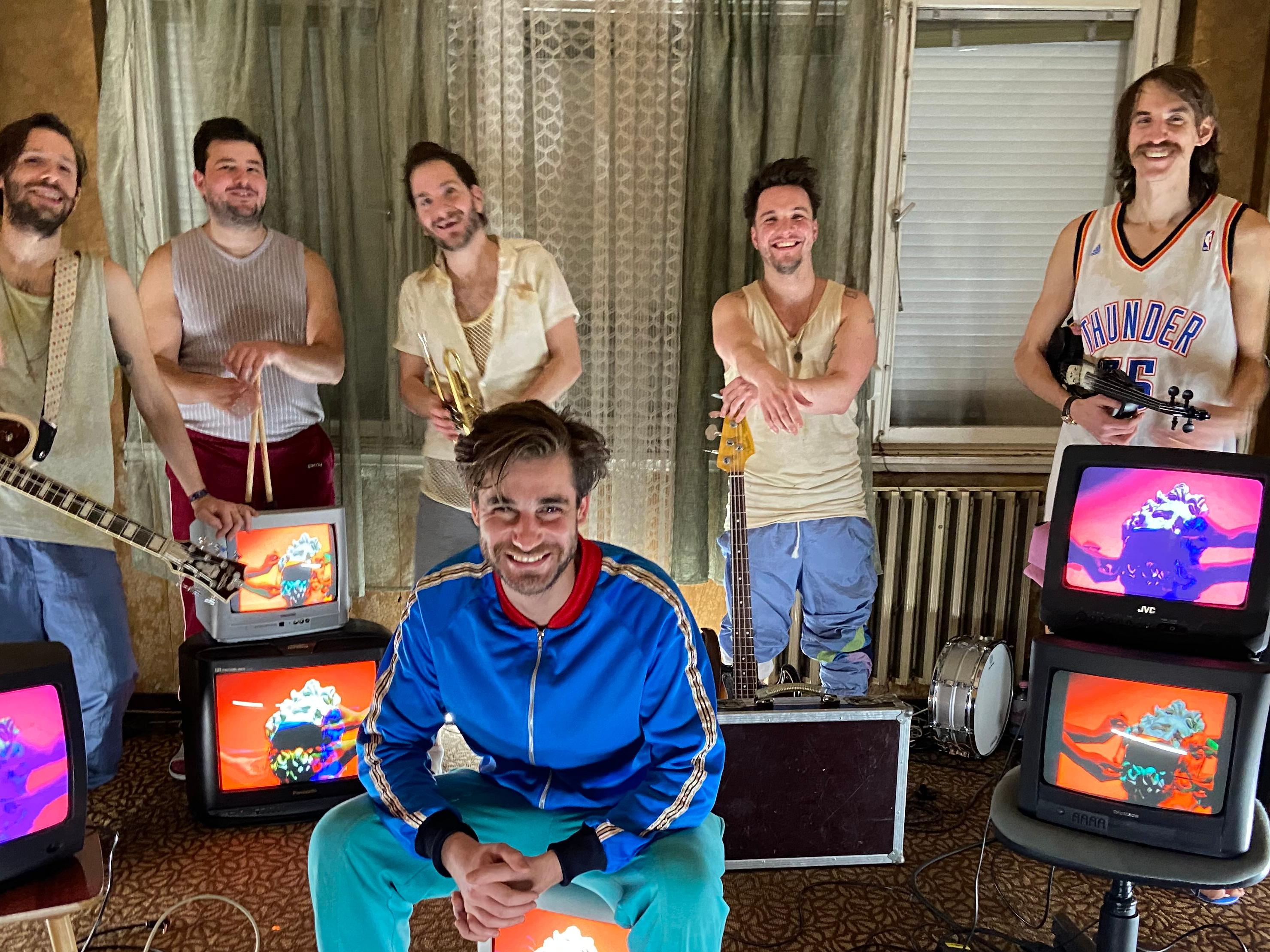 members of Bohemian Betyars sitting in a room