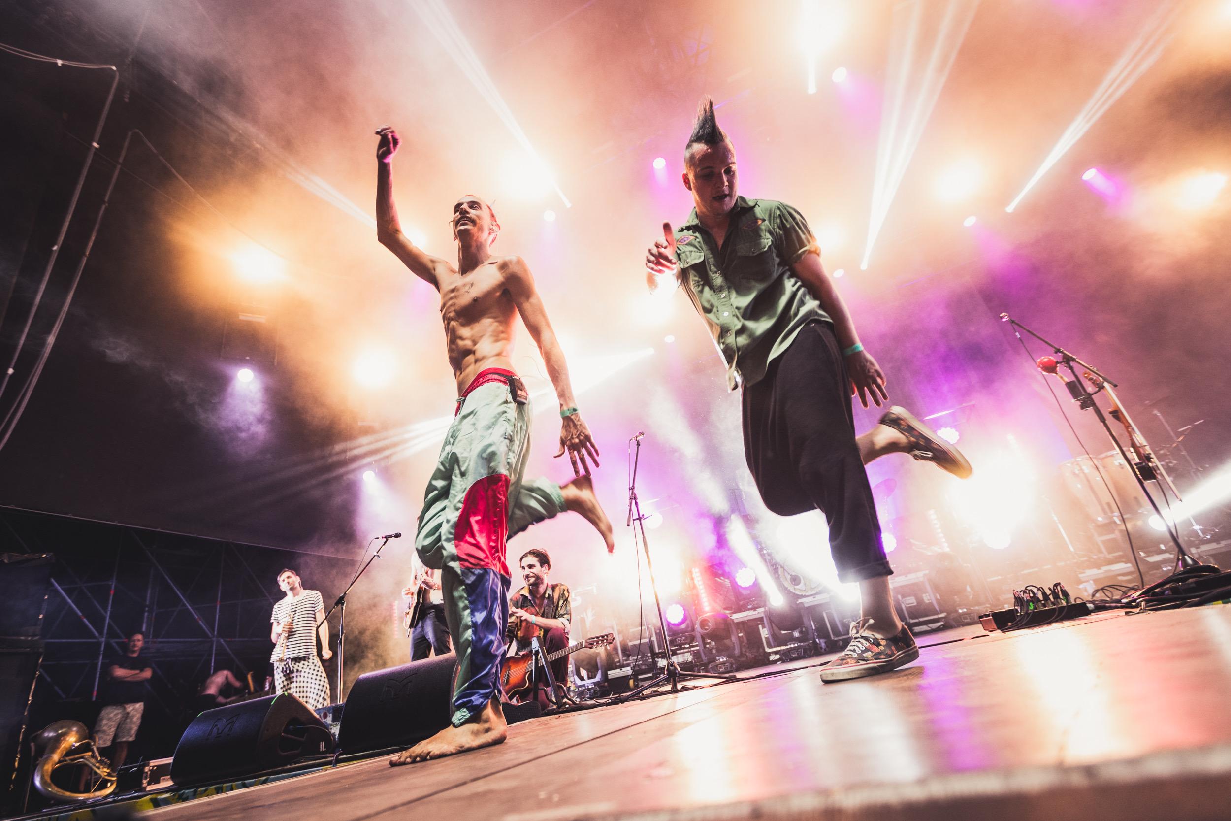 members of Bohemian Betyars are dancing on stage