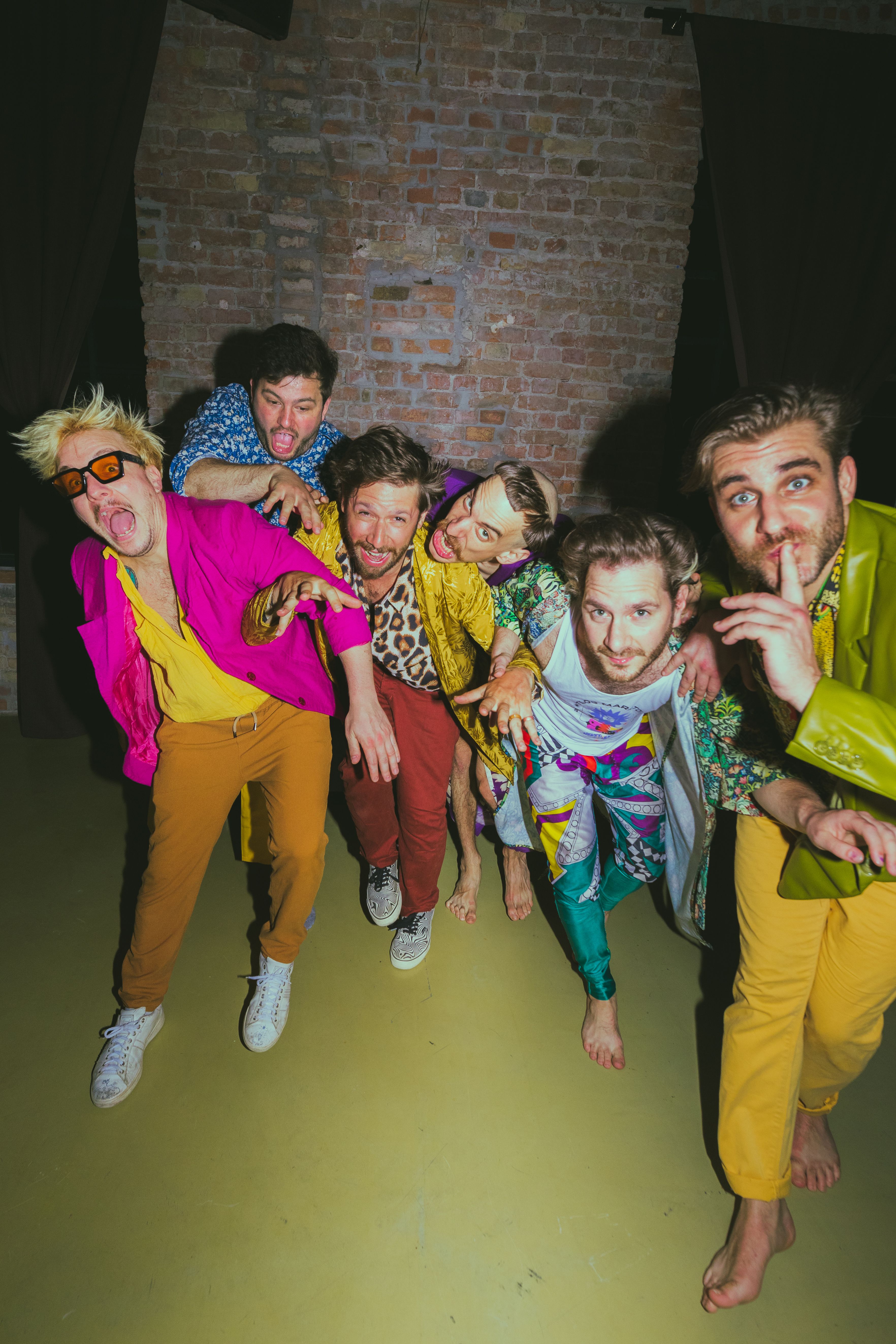 half naked violinist and singer on stage