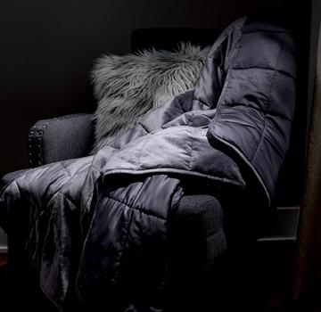 Grey weighted blanket on accent chair