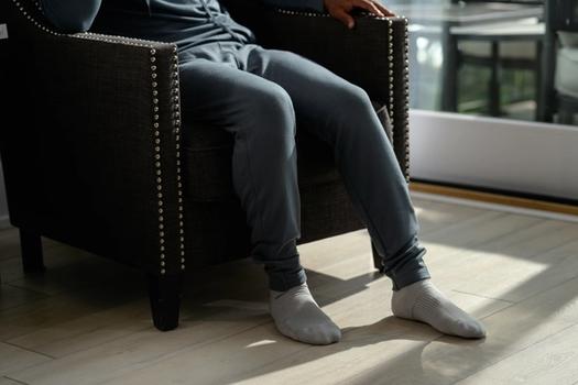 Man wearing the cozy Essential Jogger in spruce