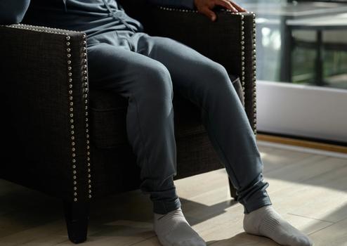 Man wearing the cozy Essential Jogger in spruce