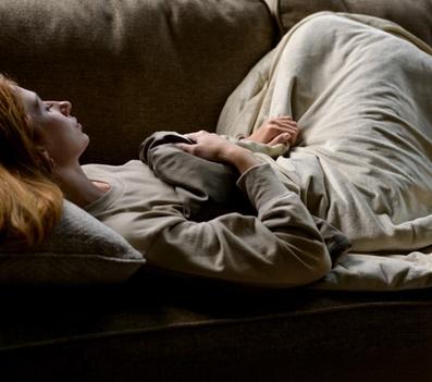 Cuddling under the cooling weighted blanket in dune and truffle