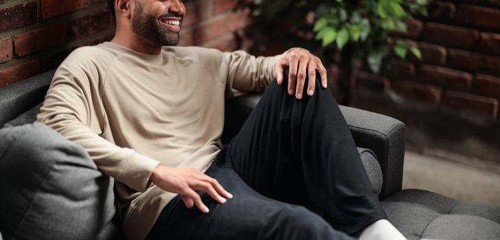 Man wearing the cozy Essential Crew in bone