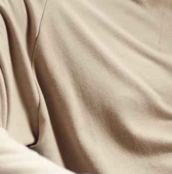 Man wearing the cozy Essential Crew in bone