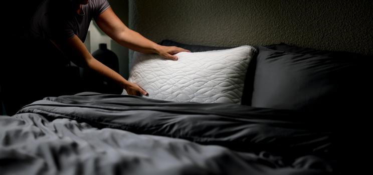 Placing the Dual Chamber Pillow on deb