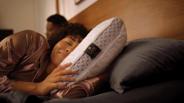 Woman sleeping with LAYR Pillow in bed
