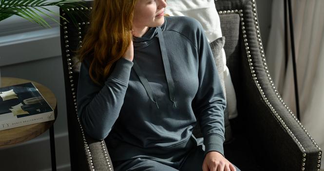 Women wearing the luxuriously soft Essential Hoodie in spruce
