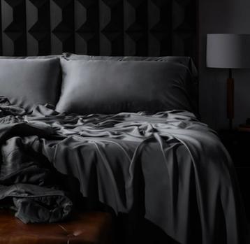 Luxury Sheets and Lightweight Blanket on a bed