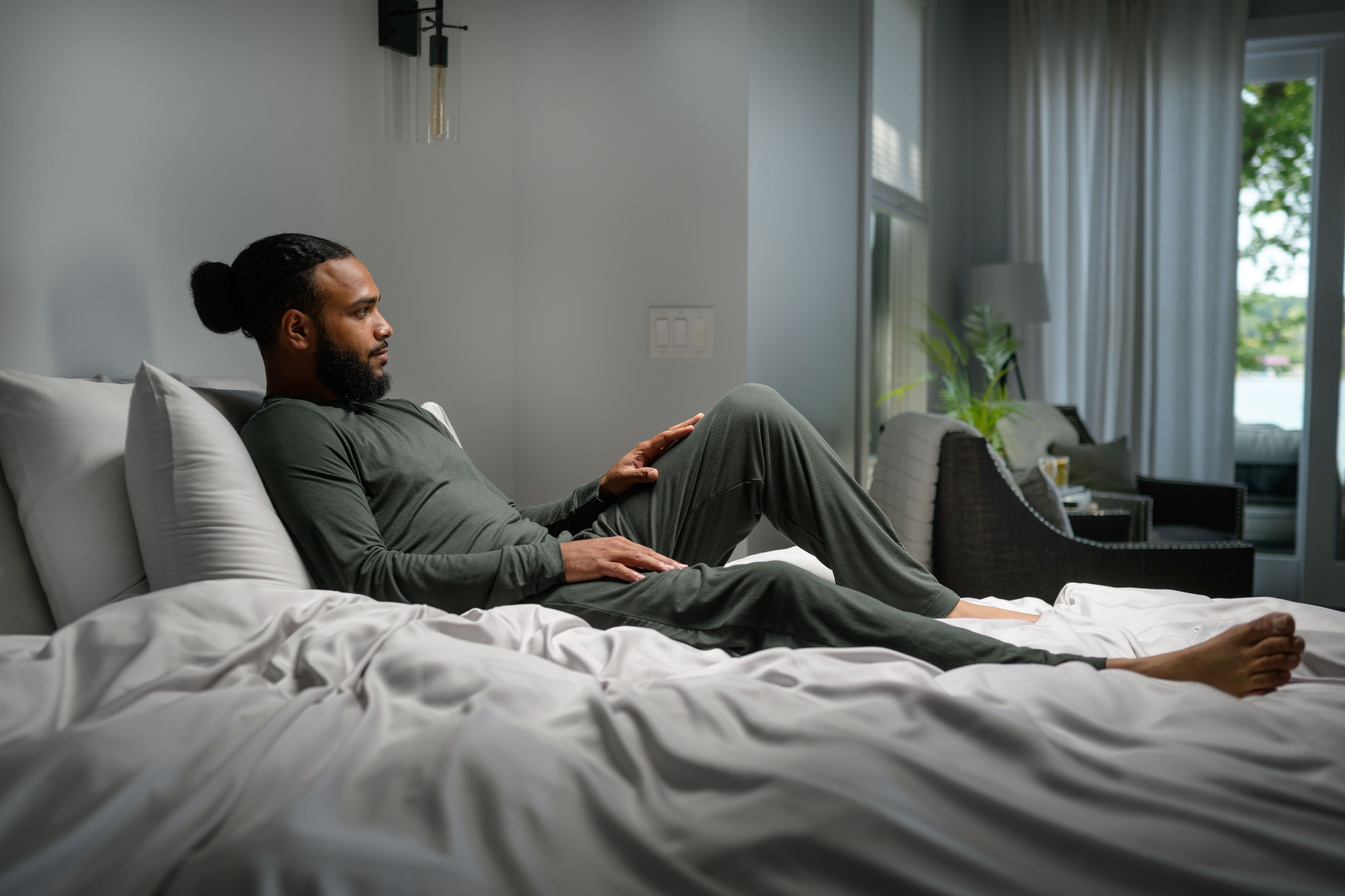 Man staying cool with Modal Pajamas in evergreen