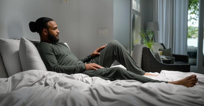 Man staying cool with Modal Pajamas in evergreen