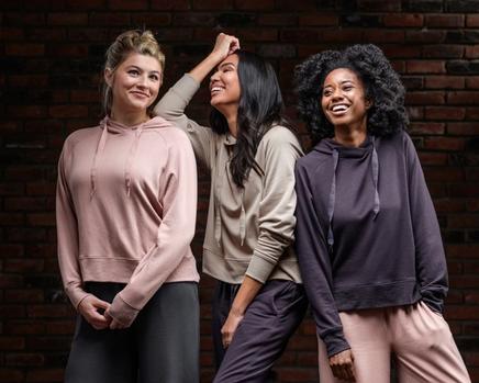 Women wearing the Essential Hoodie