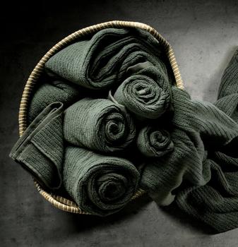 Moss Plush Performance Towels in a basket