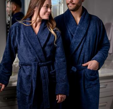his and her comfort, unisex fit on a couple in the resort bathrobe
