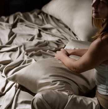 Luxury Sheet Set and Pillowcases on bed in Dune