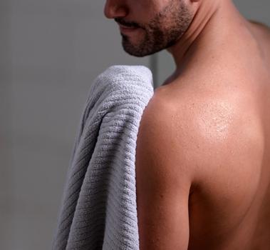 Staying dry with Plush Performance Towels in the color Pebble