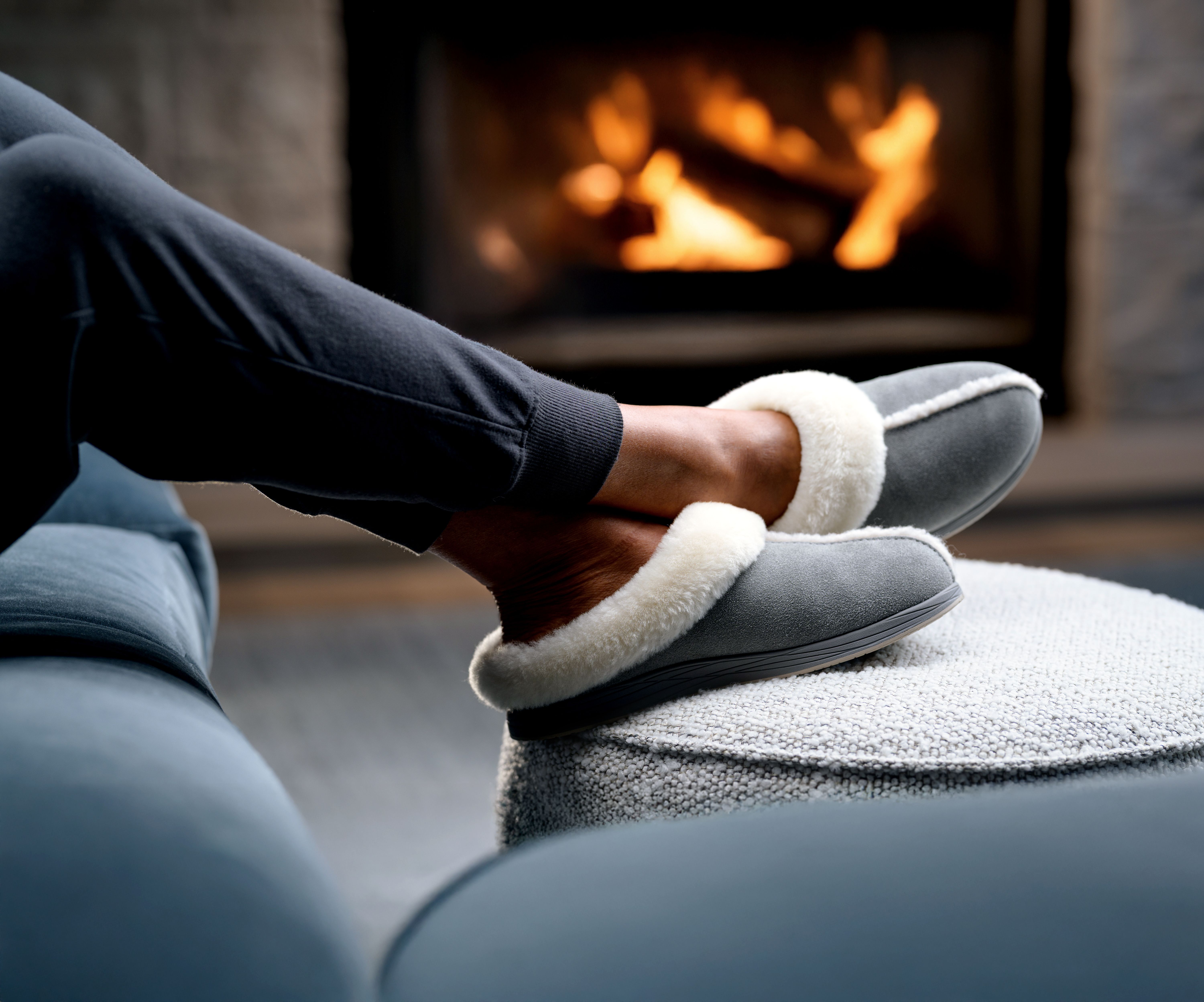 Woman's feet propped up wearing Ash Signature Slipper and Charcoal jogger