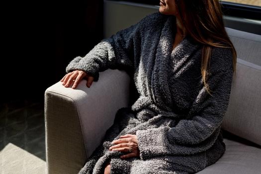 Woman wearing the cozy Ultra Plush Robe in charcoal