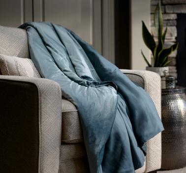Ocean weighted blanket on accent chair