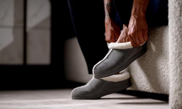 Man slipping on Ash Signature Slipper