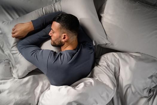 Man sleeping cool with Modal Pajamas in dusk