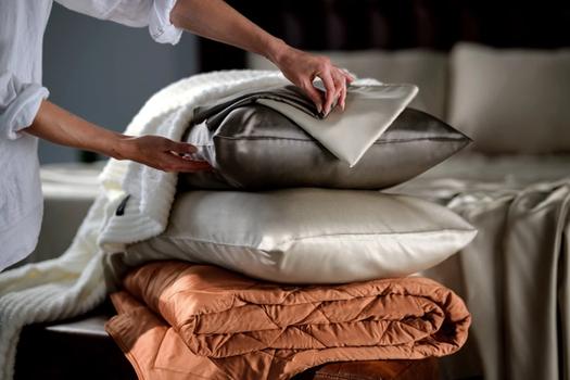 Bamboo Viscose Pillowcases stacked with Lightweight Blanket and Ultra Plush Throw