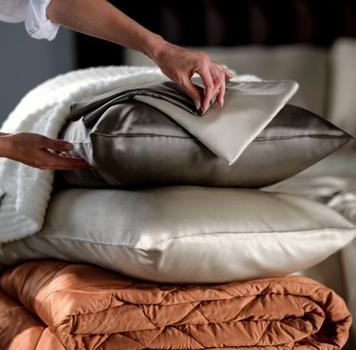 Bamboo Viscose Pillowcases stacked with Lightweight Blanket and Ultra Plush Throw