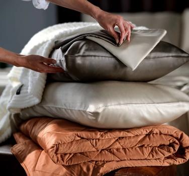 Bamboo Viscose Pillowcases stacked with Lightweight Blanket and Ultra Plush Throw