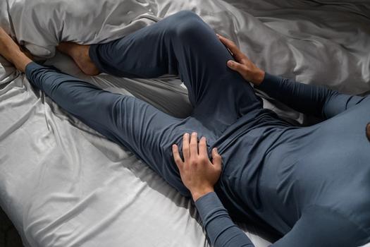 Man staying cool with Modal Pajamas in dusk